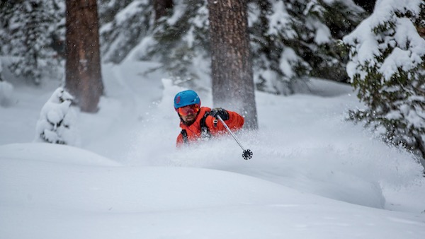 Skier exploring off-piste snow in the mountains